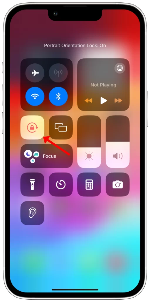 Tap the Portrait Orientation Lock button. The button will turn red to indicate that it is enabled.